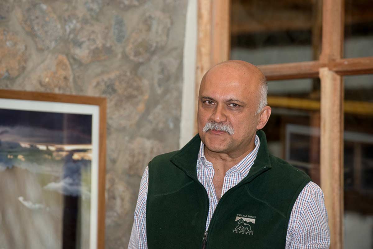 Praveen Moman, the visionary founder and CEO of Volcanoes Safaris, leading the charge in eco-tourism across the Albertine Rift region.